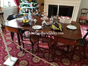 Dining Table in the Polk house set with china with the Presidential seal